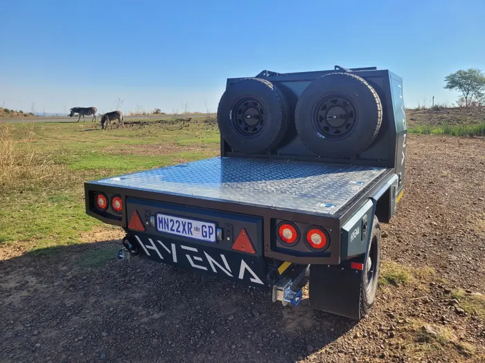 Hyena S1 flatbed rear view with HYENA branding and dual spare tyres