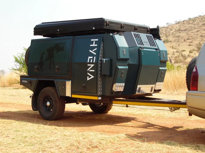 Hyena S1 side profile with rooftop tent and storage compartments